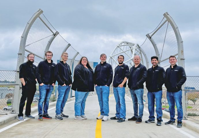  IQueue Media team members on bridge in Downtown Dallas. 